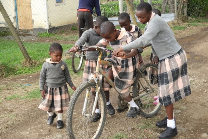 Jasiri Rafiki students riding a bike
