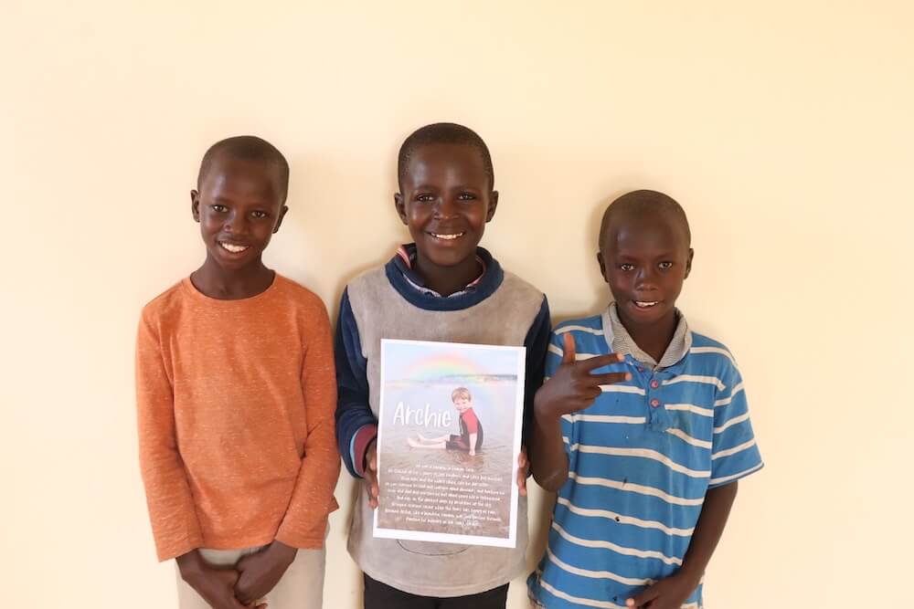 Boys with Archie poster in Mfalme Mtoto House